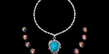 Top “Can’t Look Away” pendant in platinum featuring a 101.34 ct. Paraiba Tourmaline carved in the motif of Medusa accented by Diamonds (2.32 ctw.) and Tourmalines, on a platinum and Diamond neckla