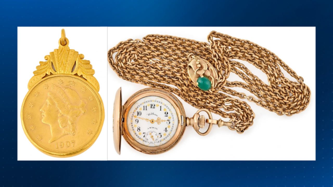 A 1907 $20 Liberty Head gold coin in a gold pendant mount beside a Waltham pocket watch and gold slider chain from Pennsylvania's unclaimed property auction